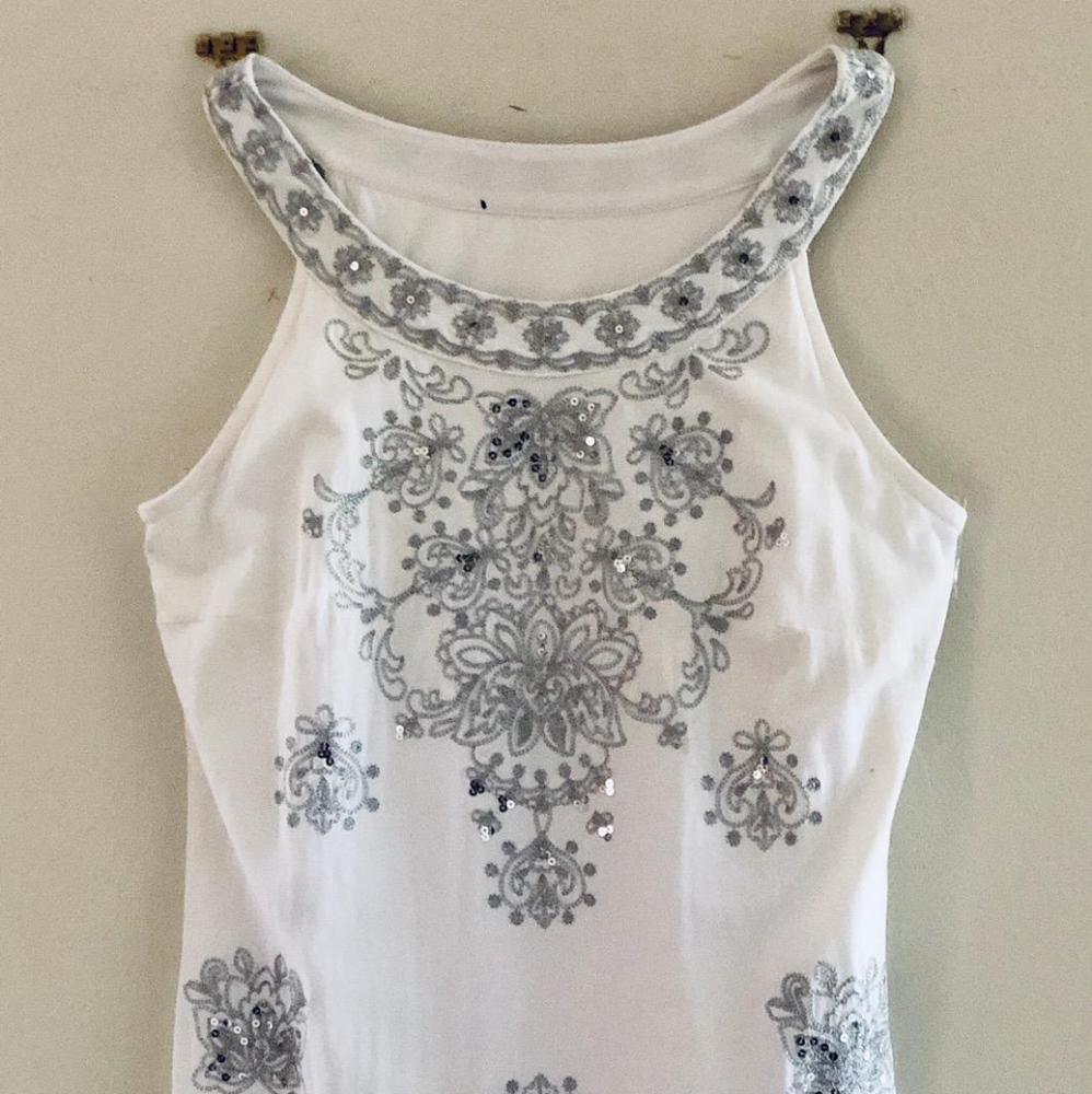 White dress with black detailing.